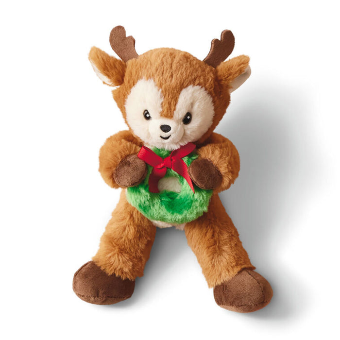 Plush deer toy with a green belly and red bow on a white background