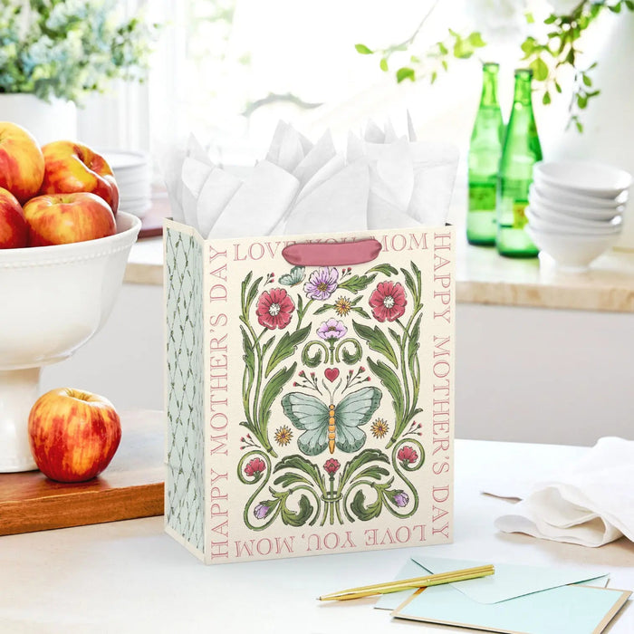 Floral Mother’s Day gift bag shown on a table with a card