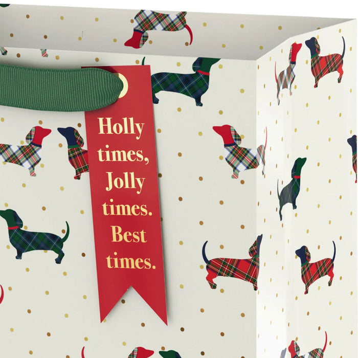 9.6-inch medium Christmas gift bag featuring plaid dachshunds on an ivory background with a festive holiday design.