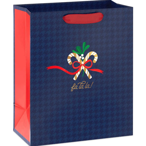 9.6-inch medium Christmas gift bag featuring a navy blue houndstooth pattern with festive candy cane accents.