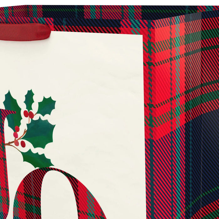 Plaid Joy jumbo Christmas gift bag featuring a classic plaid pattern and festive “Joy” message for holiday gift wrapping.