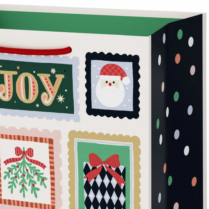 9.6-inch medium Christmas gift bag featuring a playful winter stamps-inspired design with festive seasonal artwork.