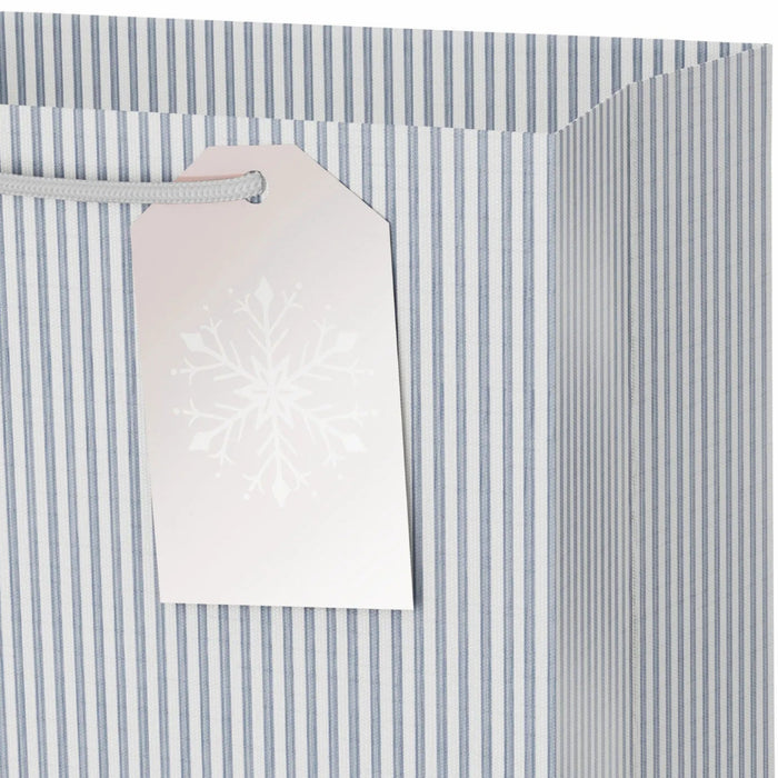 9.6-inch medium Christmas gift bag with stripes, rose gold snowflakes, and a gift tag