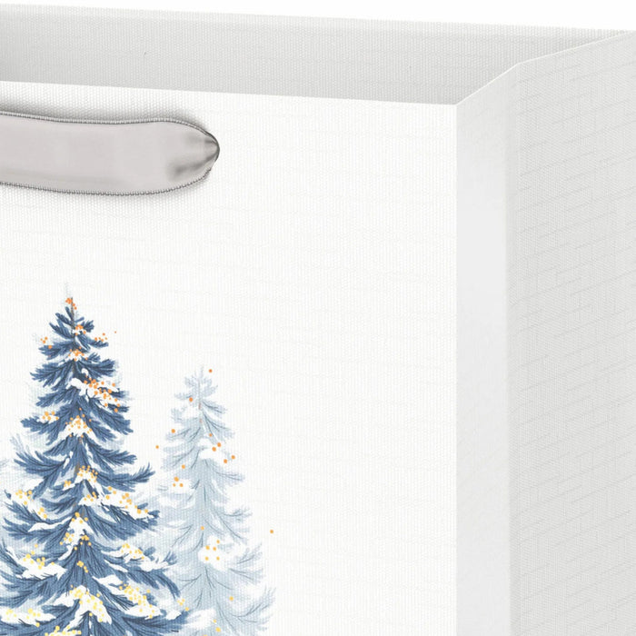 9.6-inch medium white Christmas gift bag featuring snowy tree designs for holiday gifting