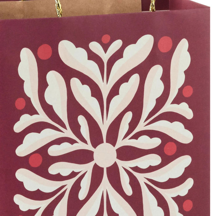 9.6-inch medium dark red Christmas gift bag featuring an abstract floral design.