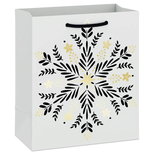 6.5-inch small Christmas gift bag featuring gold snowflakes on a black background.