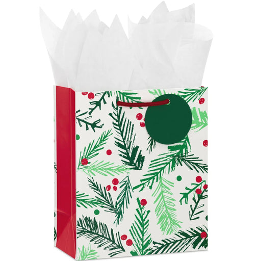 6.5-inch small Christmas gift bag featuring evergreen sprigs with a gift tag and tissue paper.