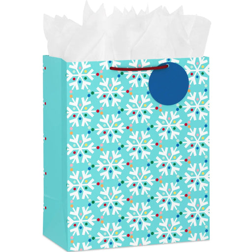13-inch large blue Christmas gift bag featuring colorful rainbow snowflakes with tissue paper.