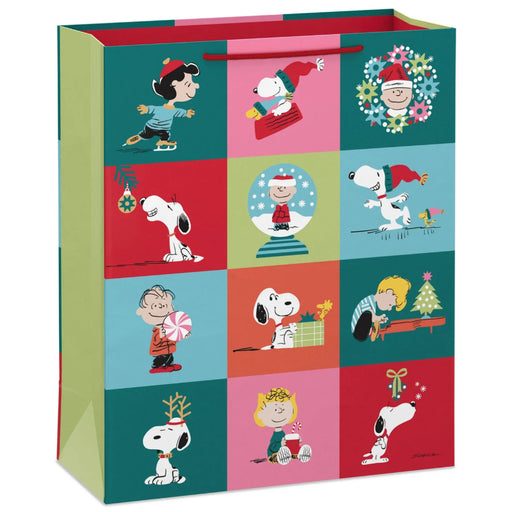 15.5-inch extra-large Christmas gift bag featuring Snoopy and Charlie Brown in a festive grid design.