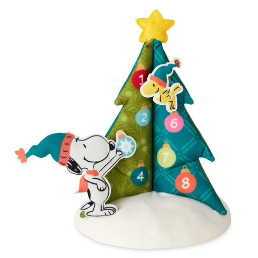 Peanuts® Christmas tree countdown calendar with festive character design, light, and sound features.