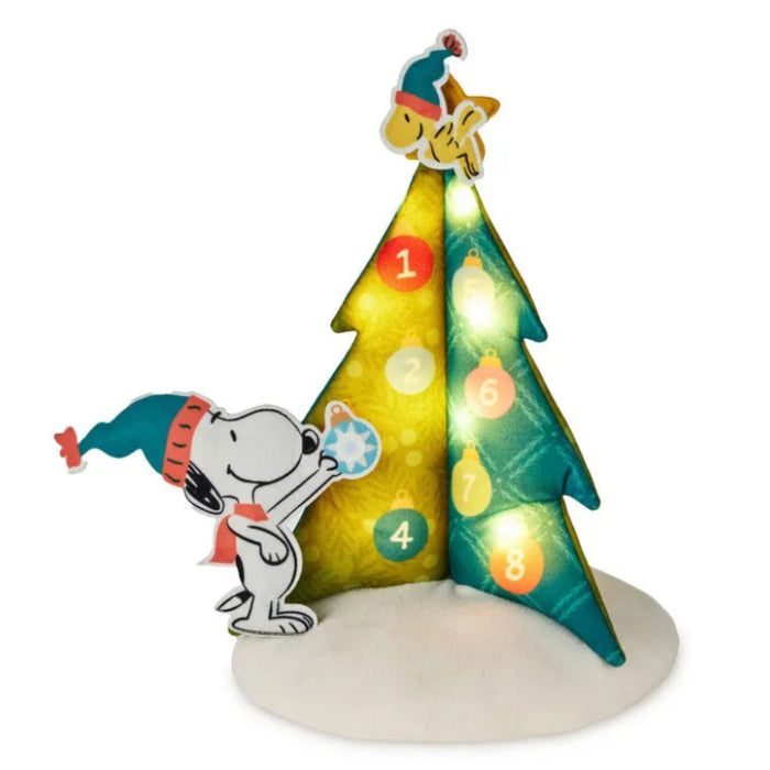 Peanuts® Christmas tree countdown calendar with festive character design, light, and sound features.