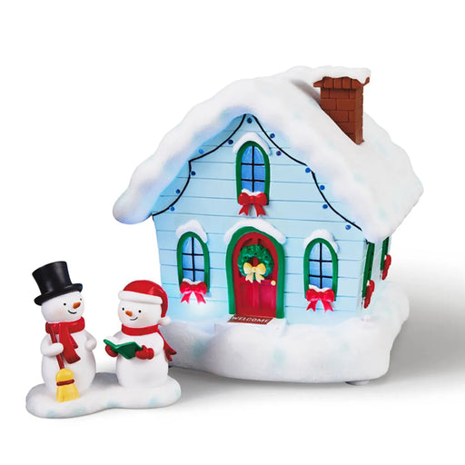 Magic Snowman Village musical Christmas house and carolers tabletop decorations with lights, set of two