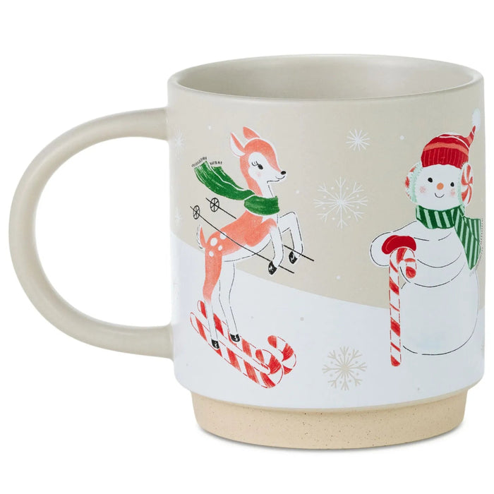 16 oz. Skiing Santa and Friends Mug featuring Santa and friends enjoying a festive winter skiing scene