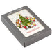 Hallmark Peanuts Gang Christmas cards featuring Snoopy and friends caroling around a decorated Christmas tree, pack of 16.