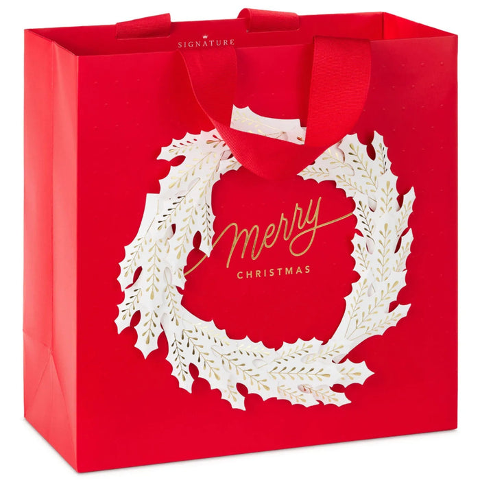 13-inch large red Christmas gift bag featuring a white and gold wreath design