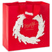13-inch large red Christmas gift bag featuring a white and gold wreath design
