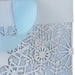Hallmark 10.4-inch large Christmas gift bag featuring white snowflakes on a light blue background, complete with tissue paper, perfect for wrapping holiday presents and festive gifts for family and friends.