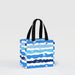 A blue and white striped shopping bag with handles, designed for carrying groceries or personal items.