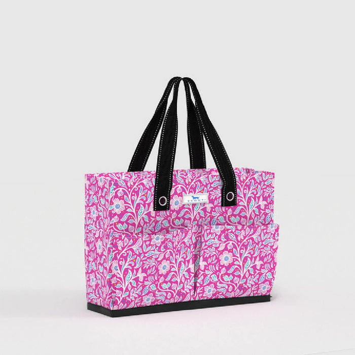 A stylish tote bag in pink and blue with a contrasting black handle.