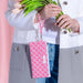 A blue and white wristlet bag adorned with a wavy pattern, suitable for casual outings and daily use.