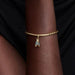 Gold bracelet with a cicada-shaped charm on the wrist