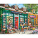 A puzzle box featuring a detailed illustration of a cozy bookstore scene with shelves and books.