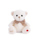 A white teddy bear wearing a brown bow, sitting upright against a soft background.