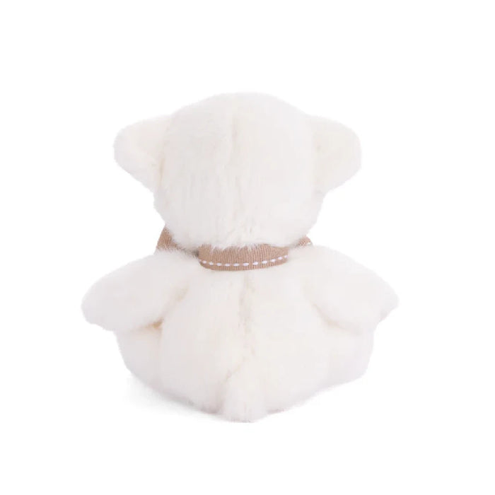 A cute white teddy bear with a brown bow, positioned on a light surface, radiating warmth and comfort.