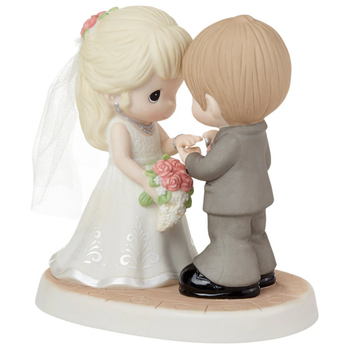 Romantic wedding figurine featuring a beautifully detailed bride and groom.
