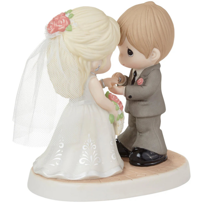 Romantic wedding figurine featuring a beautifully detailed bride and groom.