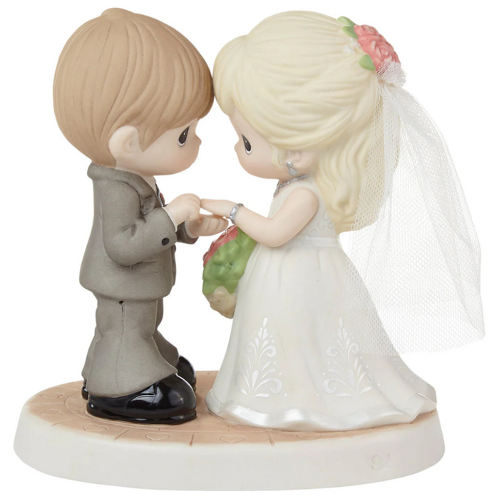 Romantic wedding figurine featuring a beautifully detailed bride and groom.