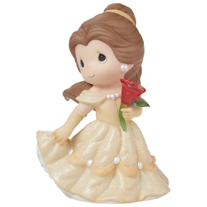 Beautiful buttery yellow gown with holding the enchanted rose.