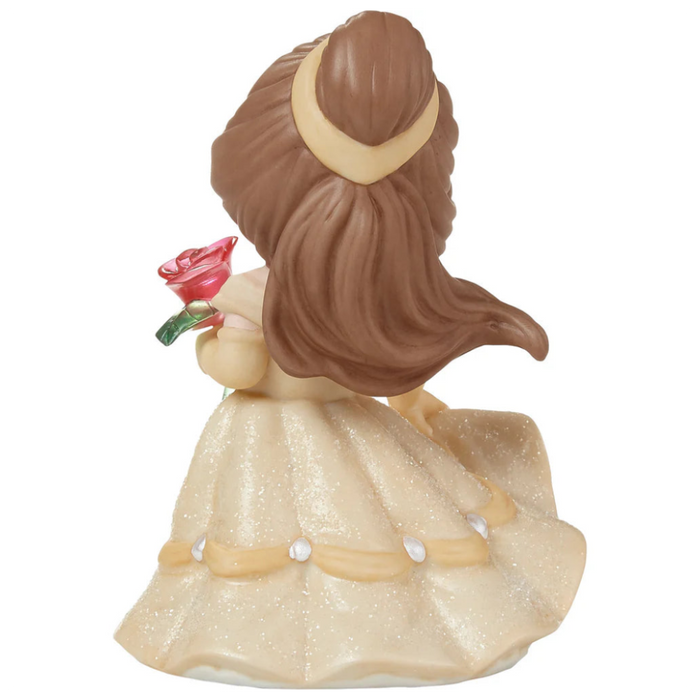 Beautiful buttery yellow gown with holding the enchanted rose.