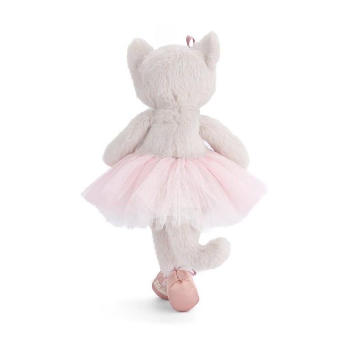 A soft toy cat adorned with a frilly tutu skirt, exuding a charming and playful vibe.