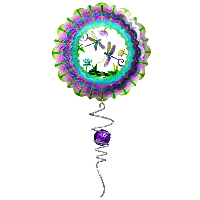 A purple and green dragonfly balloon with a spiral tail, floating against a clear blue sky.