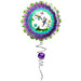A purple and green dragonfly balloon with a spiral tail, floating against a clear blue sky.