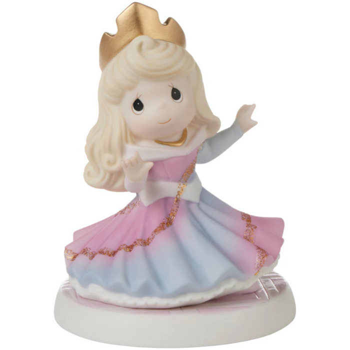 Aurora’s gown beautifully appears to change from blue to pink