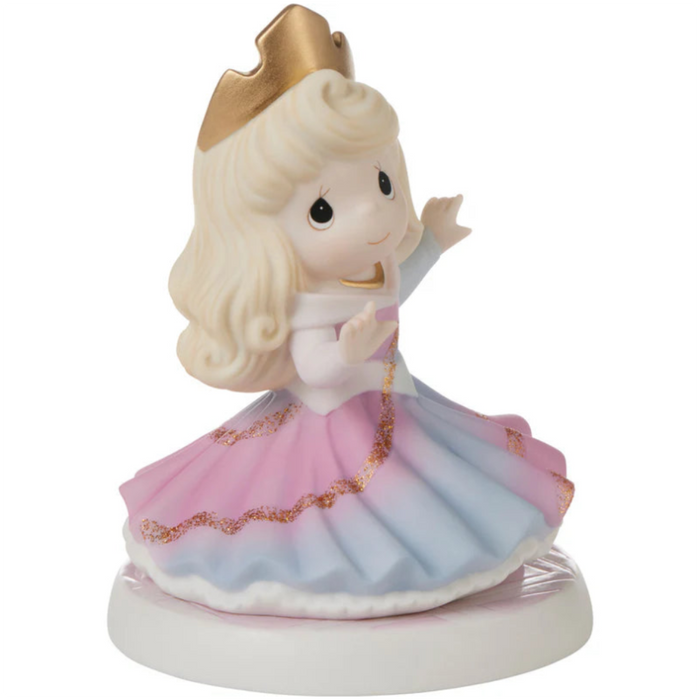 Aurora’s gown beautifully appears to change from blue to pink