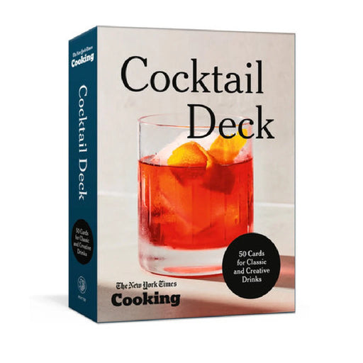 A vibrant cocktail deck set up by the cookbook club, featuring colorful drinks and elegant glassware on a wooden table.