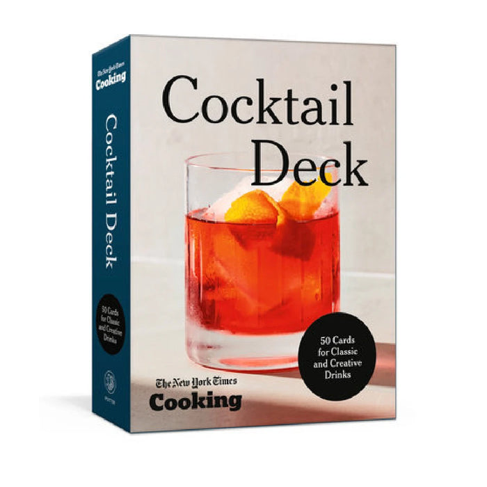 A vibrant cocktail deck set up by the cookbook club, featuring colorful drinks and elegant glassware on a wooden table.