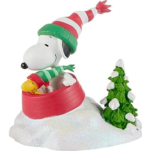 side view of snoopy on his sled