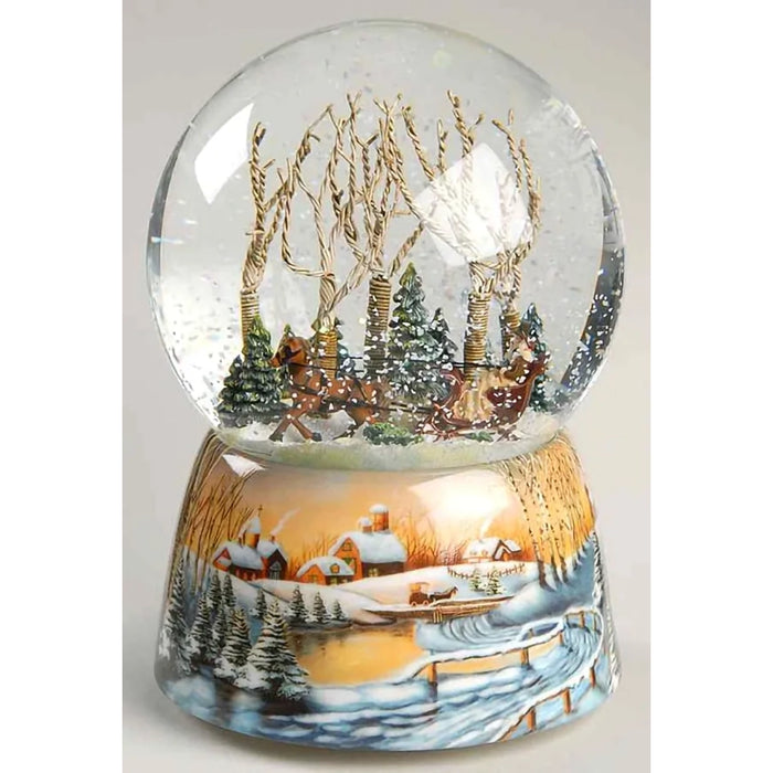 wind-up musical glitter dome featuring a charming winter scene surrounded by sparkling swirling glitter.