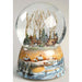wind-up musical glitter dome featuring a charming winter scene surrounded by sparkling swirling glitter.