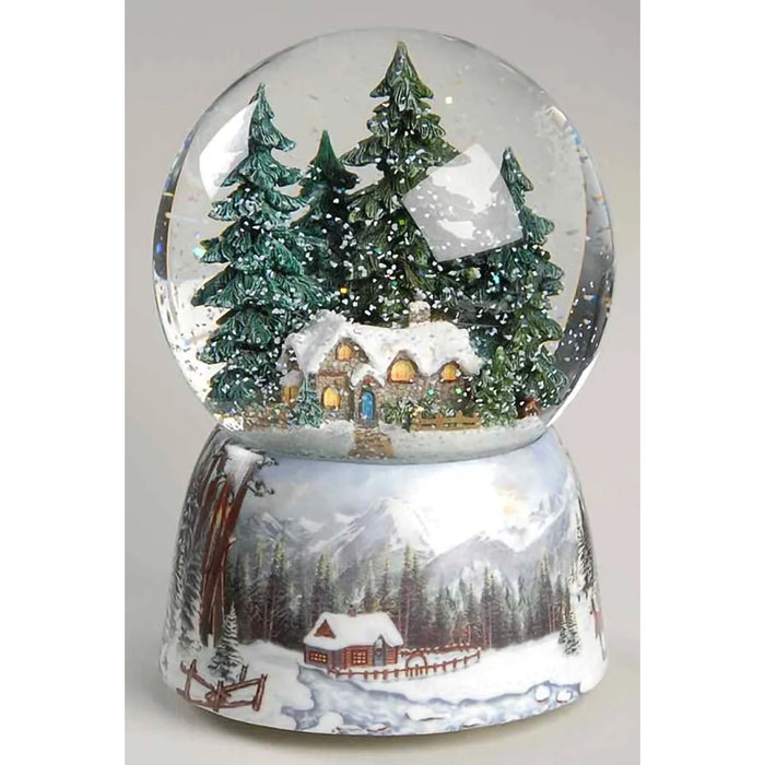wind-up musical glitter dome featuring a charming winter scene surrounded by sparkling swirling glitter.