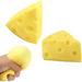 Yellow cheese-shaped stress ball with a hand squeezing one of them on a white background