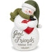 Snowman figurine with a heart and 'Good Friends Warm the Heart' text on a white background