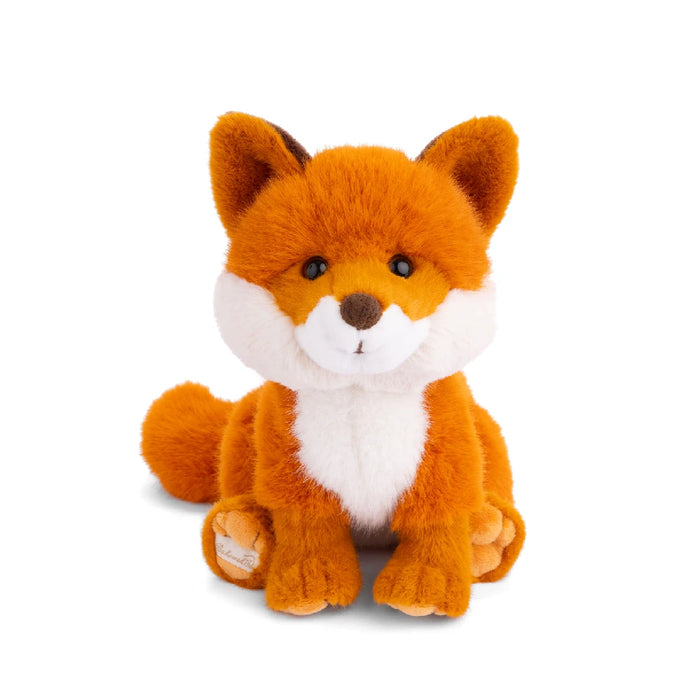  A plush fox toy sitting on a plain white background, showcasing its soft fur and friendly expression.