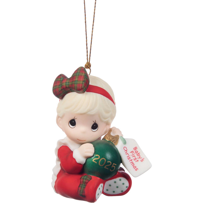 Christmas ornament of a baby girl with a green ball and '2025' on a white background
