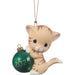 Cat-shaped ornament holding a green ball with '2025' on a white background