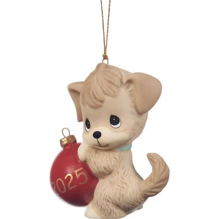 Dog-shaped Christmas ornament holding a red ball with '2025' on a white background